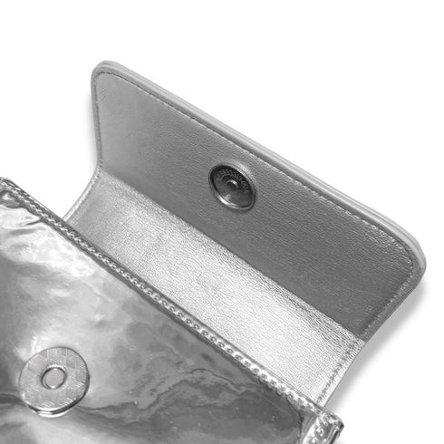 Metallic pouch with textured surface on a white background