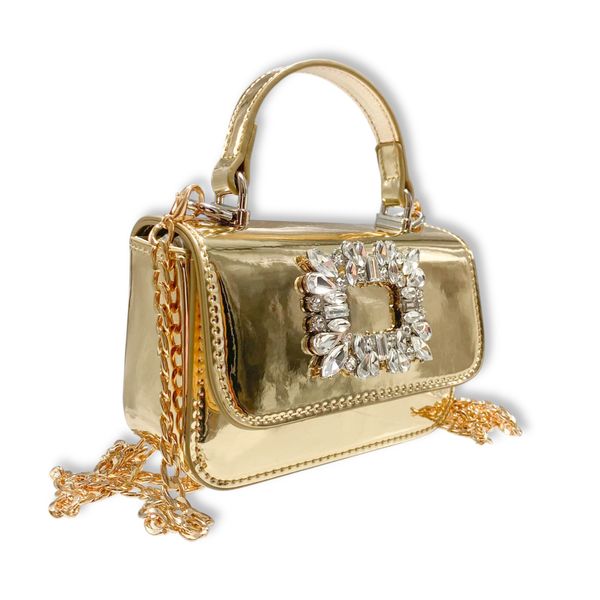 Gold handbag with embellishments on a white background. detachable gold chain