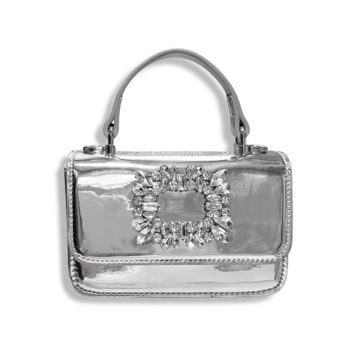 Silver handbag with a prominent gemstone embellishment on a white background