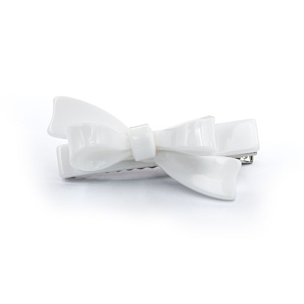 White bow hair clip on a white background
