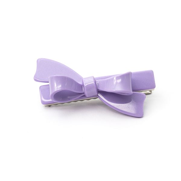 Lavender bow-shaped hair clip on a white background