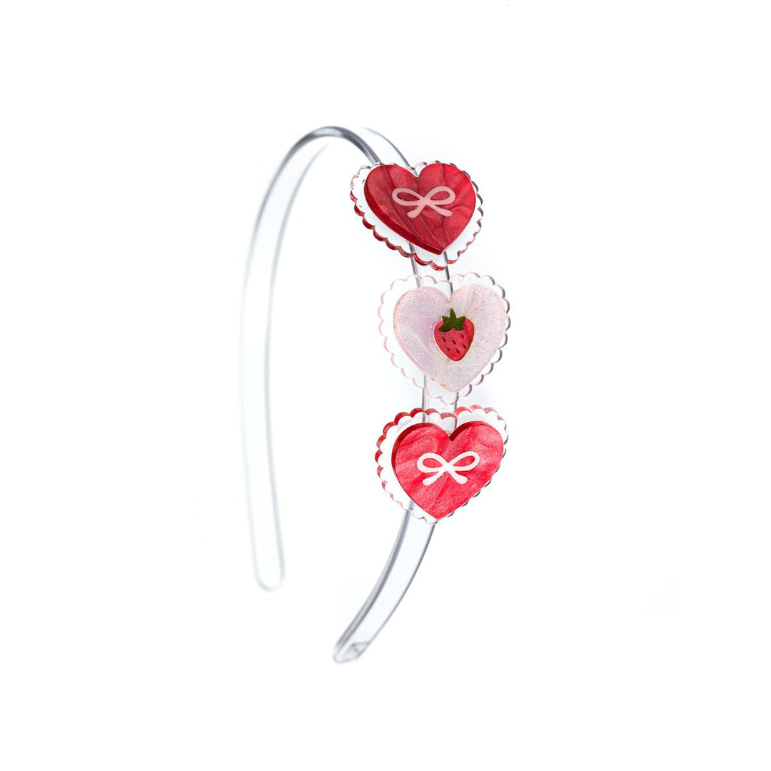 headband with red hearts and pink hearts. the hearts have scalloped edges 