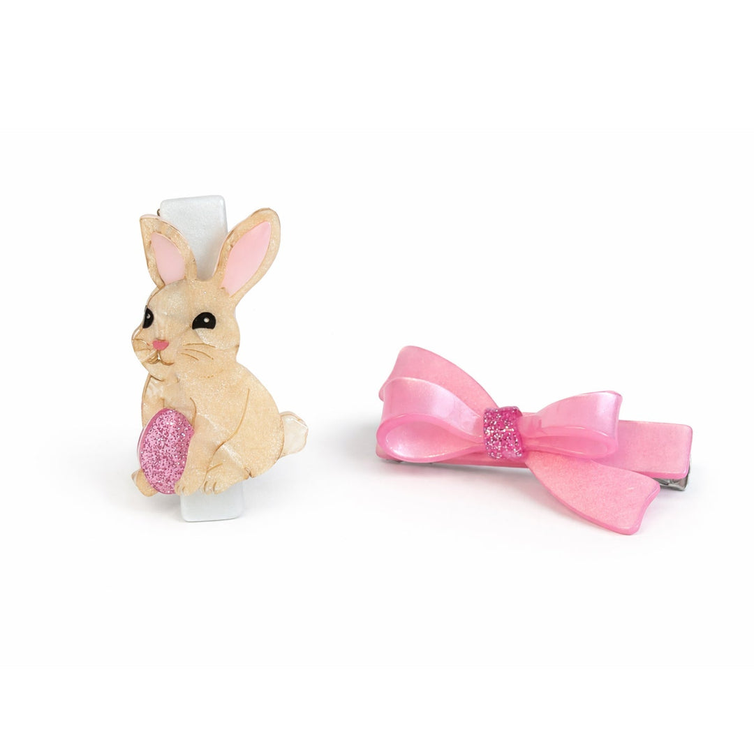 Bunny-shaped hair clip with a pink bow on a white background