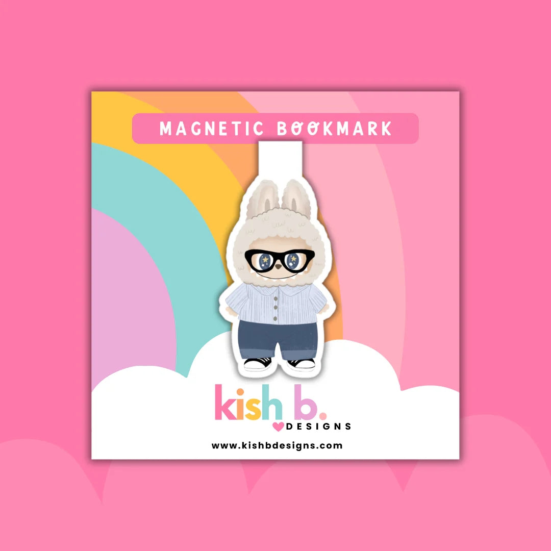 Magnetic bookmark with cartoon labubu character wearing glasses on a colorful background, featuring the brand 'kish b.'