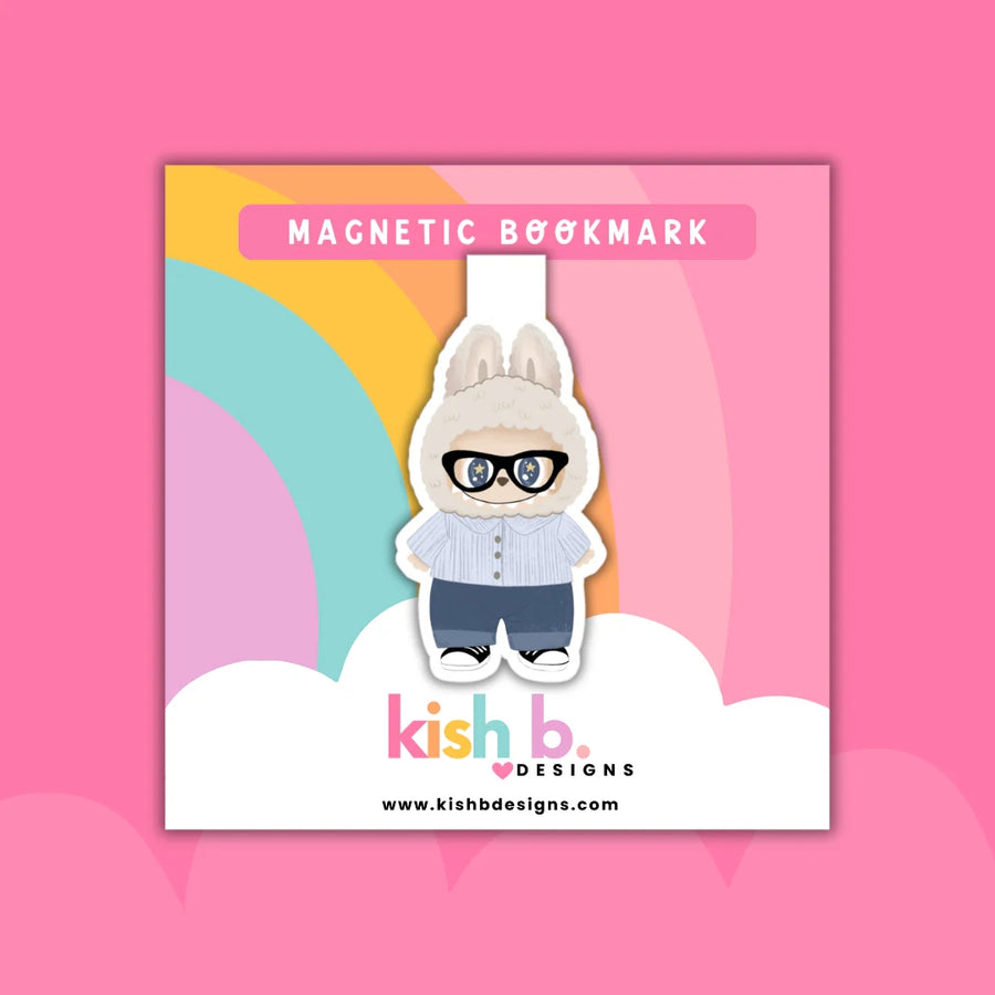 Magnetic bookmark with cartoon labubu character wearing glasses on a colorful background, featuring the brand 'kish b.'