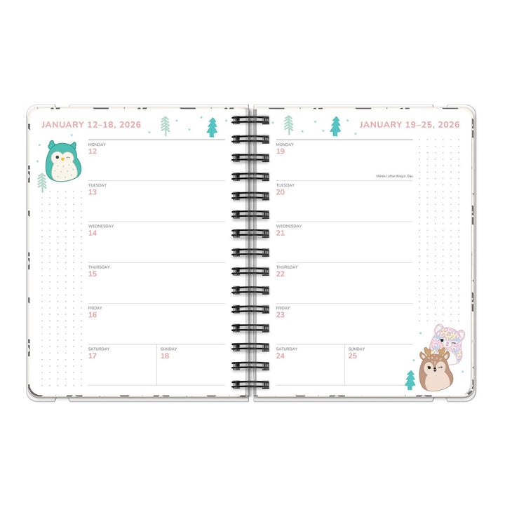 Open planner with animal-themed pages on a white background