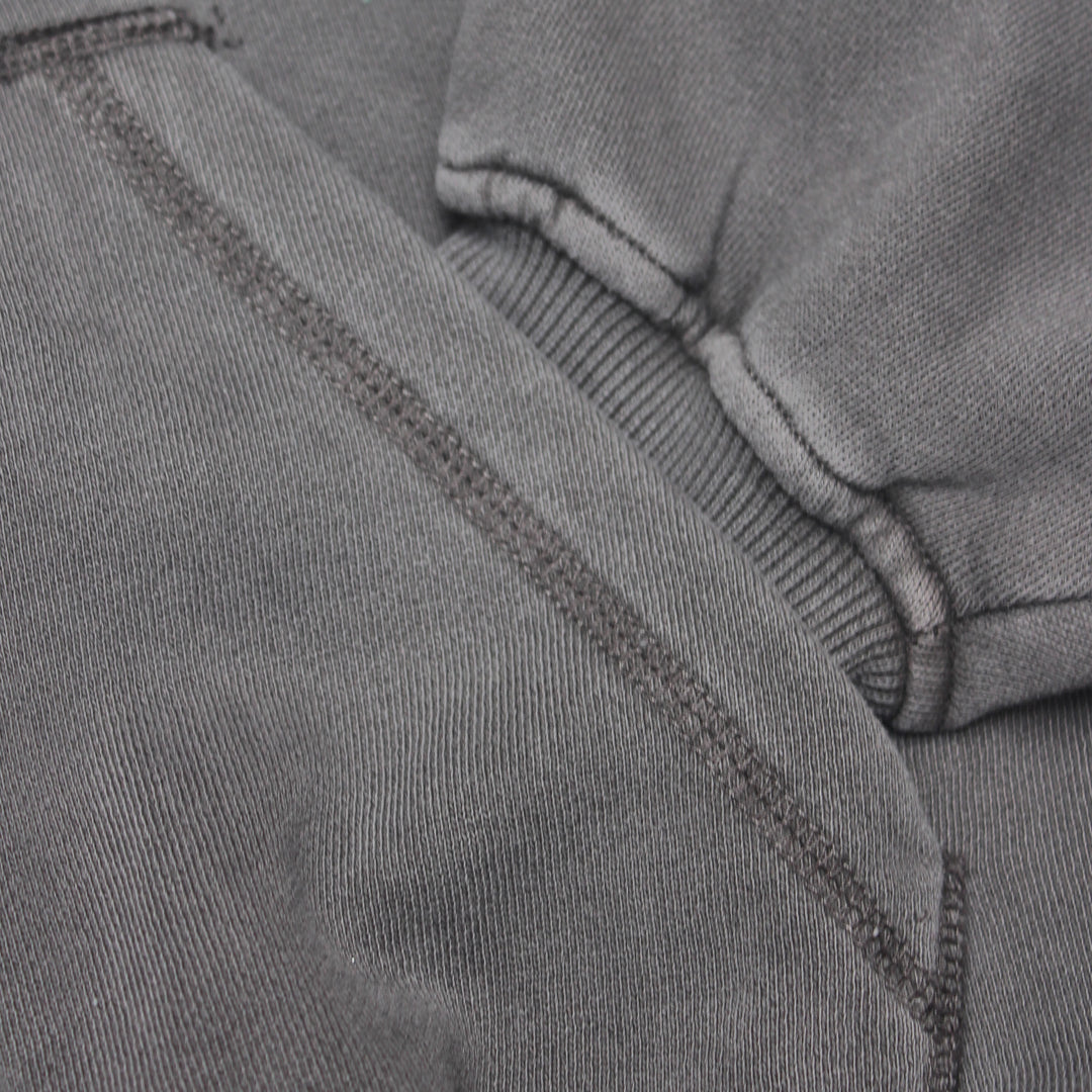 Close-up of gray fabric with stitching detail