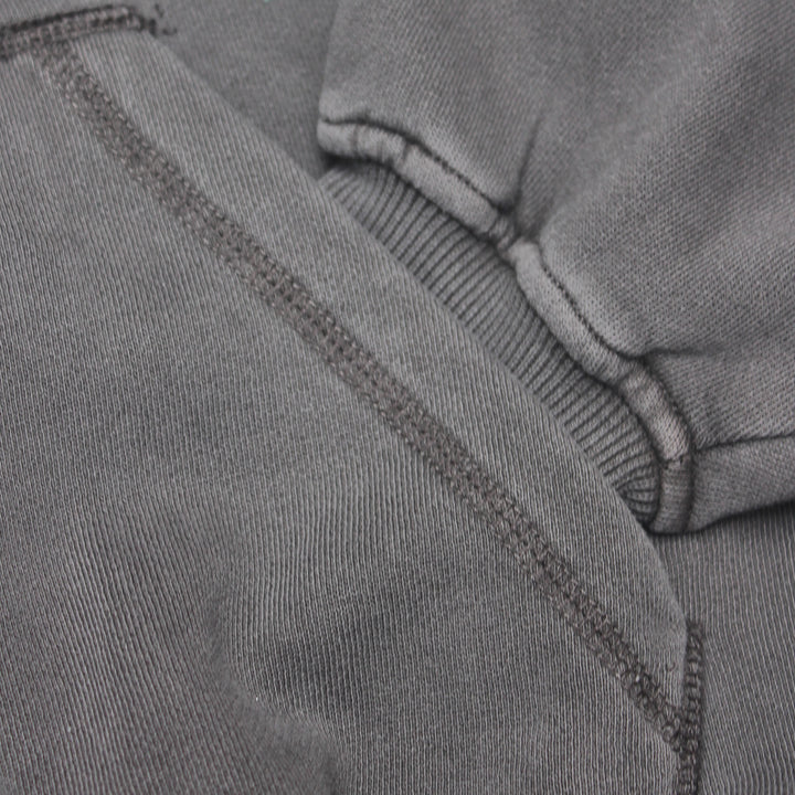 Close-up of gray fabric with stitching detail