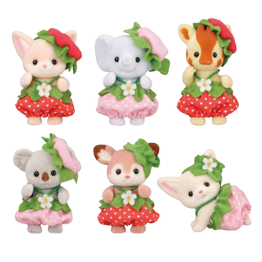 Set of six small animal figurines in colorful dresses on a white background