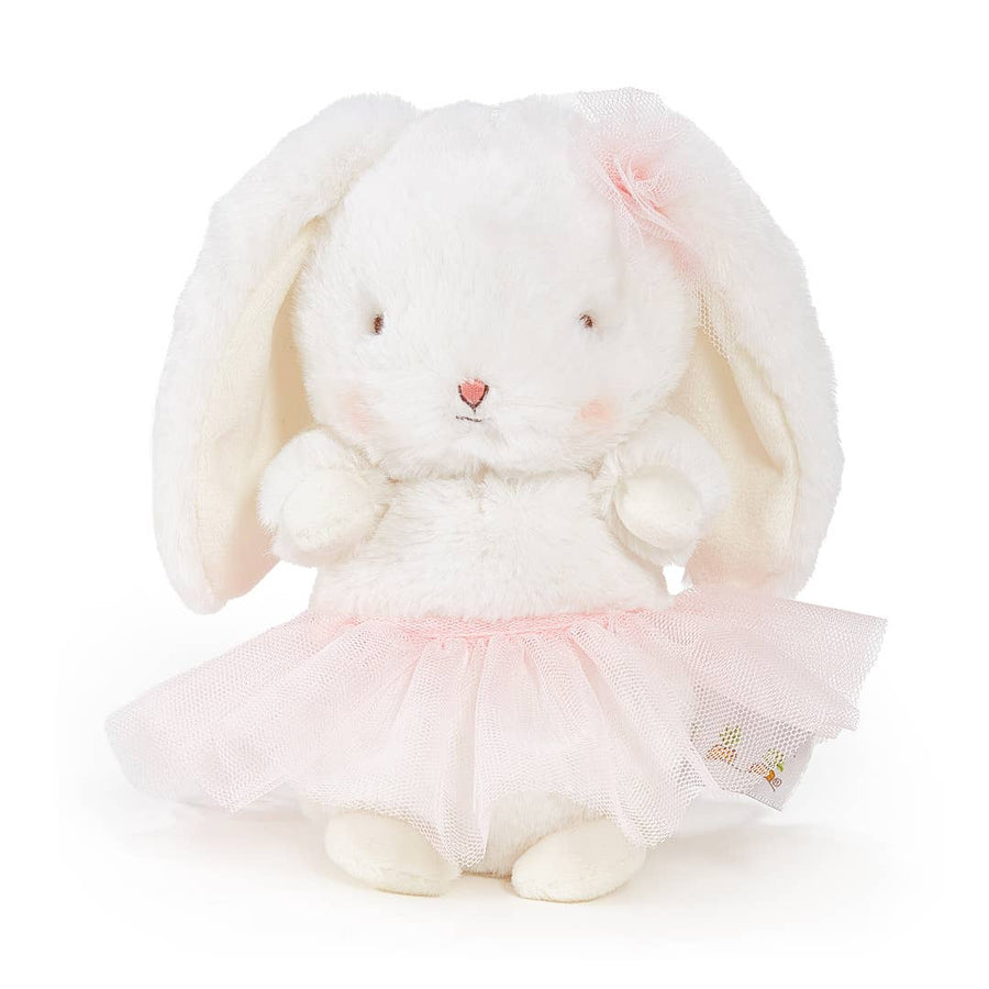 White plush bunny toy with a pink tutu on a white background