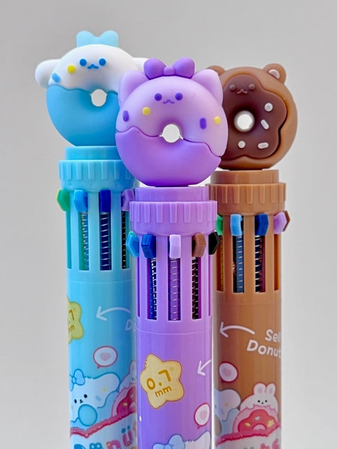 3 different color options for these retractable pens: blue, purple, chocolate all with donuts on top. 