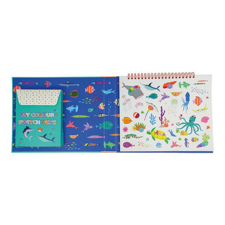 inside pages of color magic book in ocean theme. these pages show stickers and the package of the color markers on one side. 