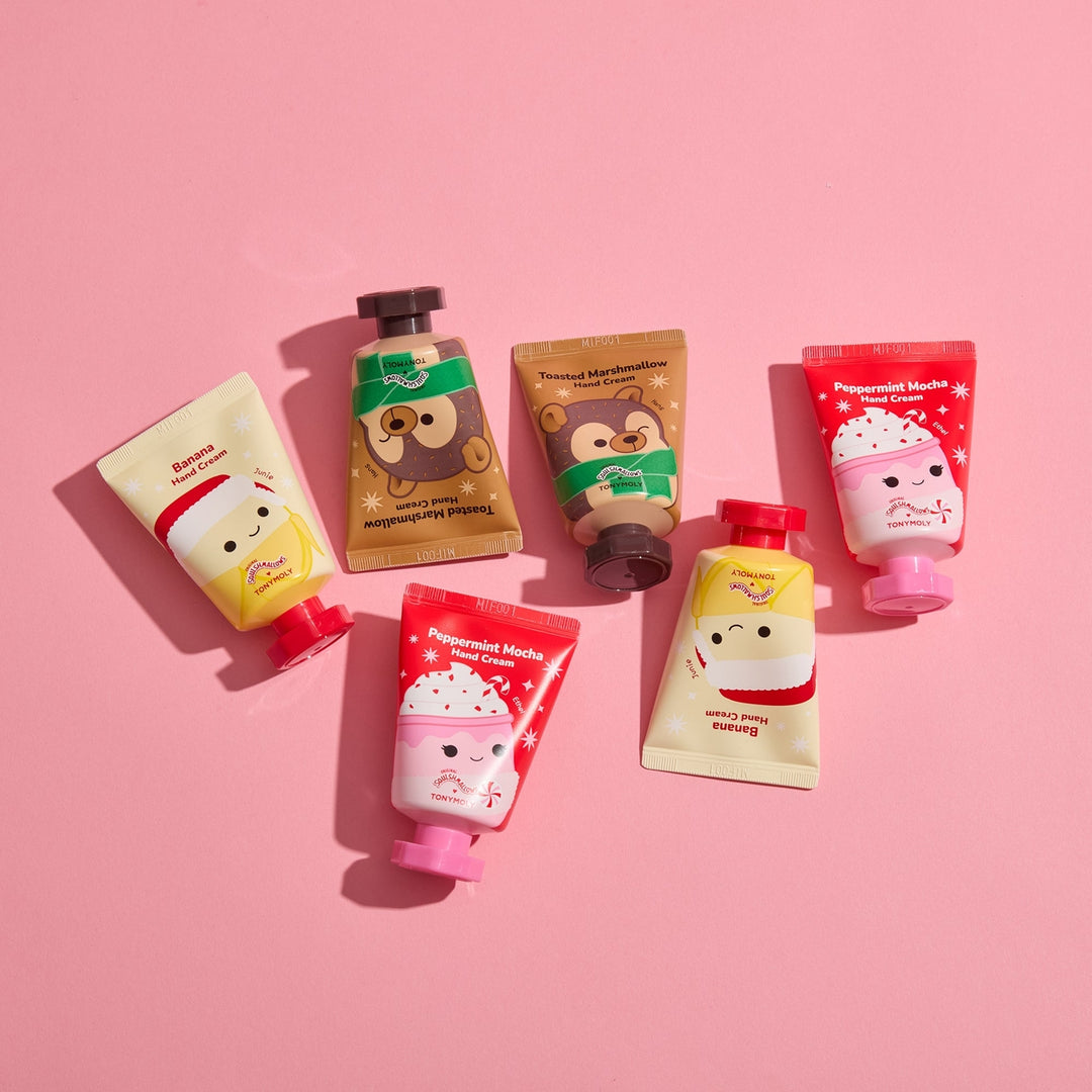 Set of cartoon-themed hand creams on a pink background
