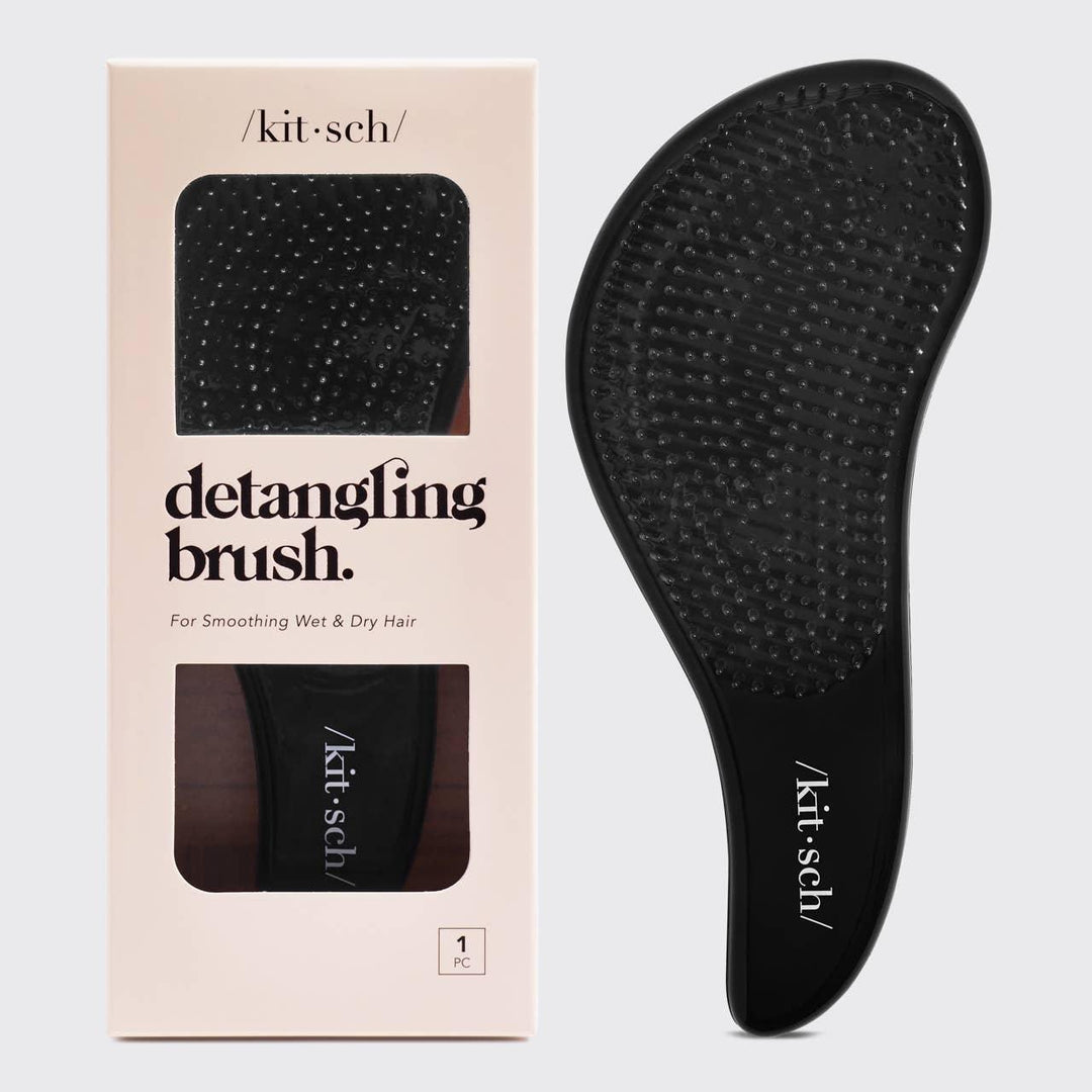 sleek black detangling brish with flexible bristles and curved design