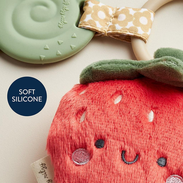 close up of a strawberry plush on a ring 