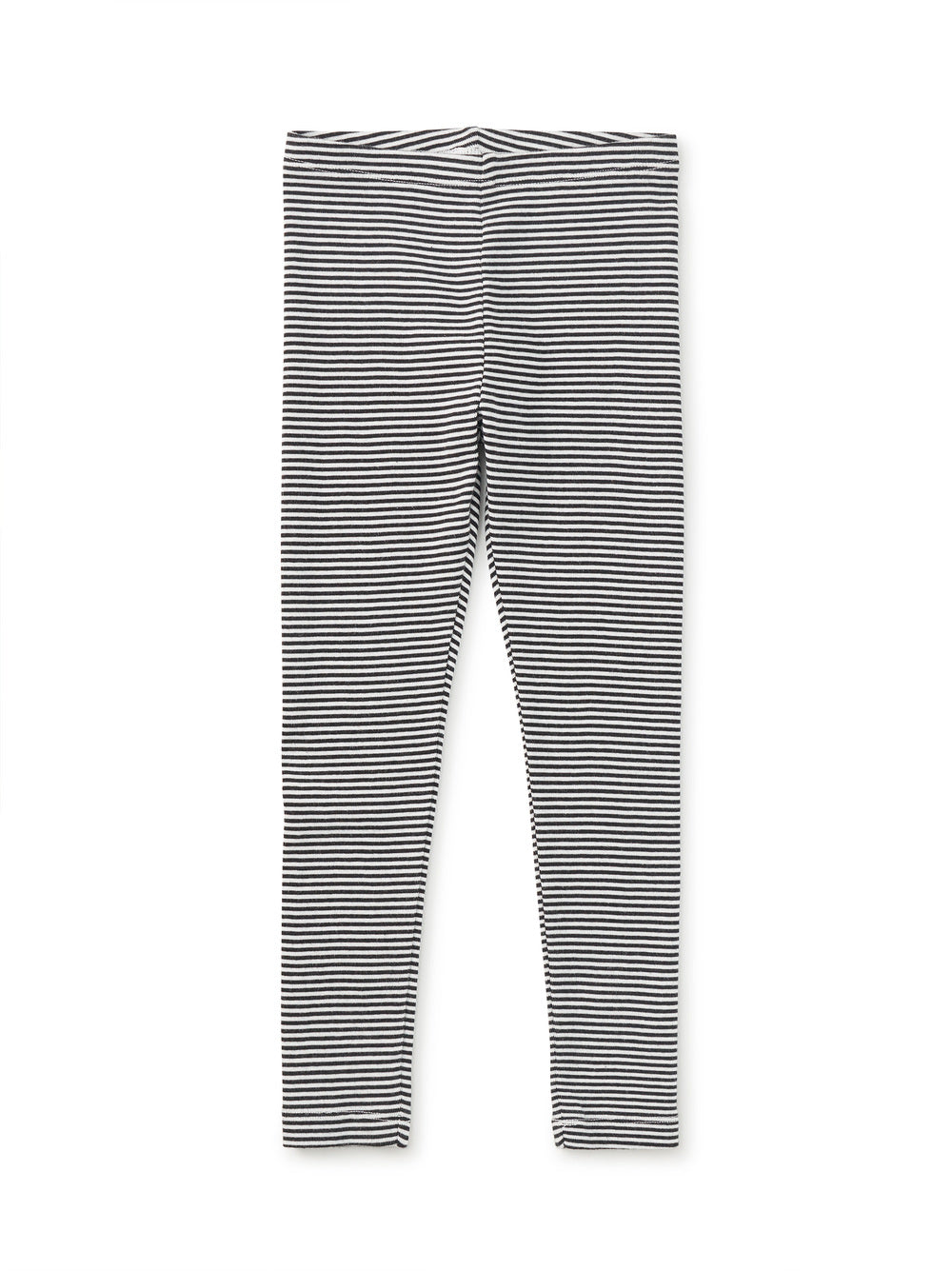 Black and white striped leggings on a white background