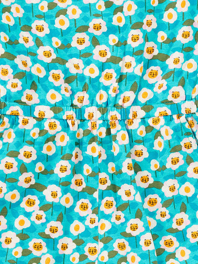 Children's romper with daisy pattern on a white background