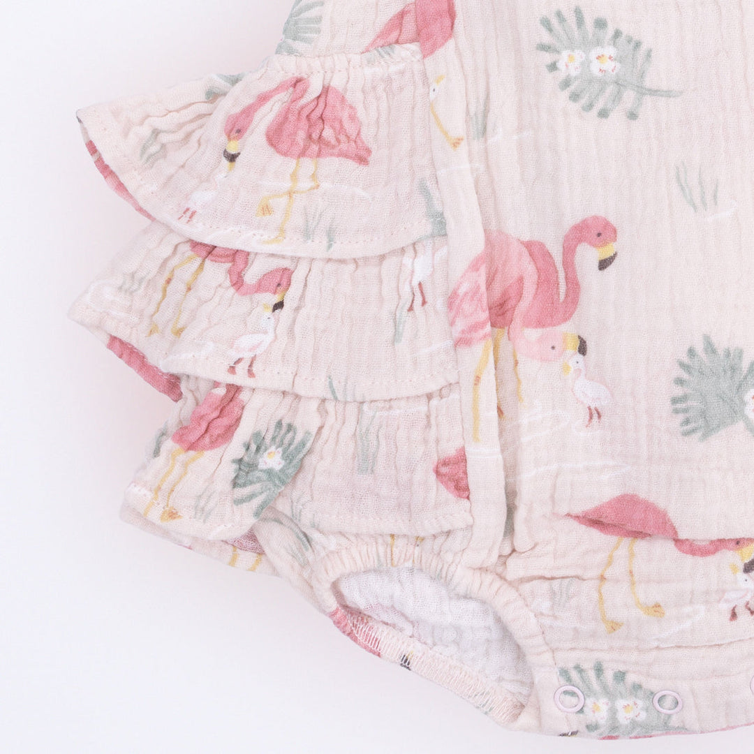 Floral baby romper with pink flamingo design on a white background