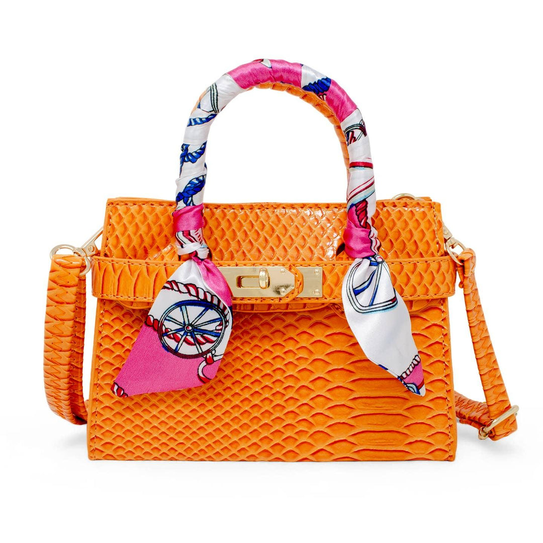 kids handbag, crocdile looking finish in an orange color. scarf on the handle. detahcable strap