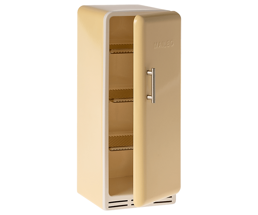 vintage inspired yellow refrigerator with the door slightly ajar with metal shelves inside