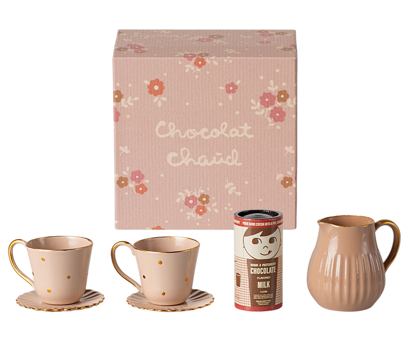 small floral box that contains 2 tin cups and saucers, pitcher and hot chocolate. 