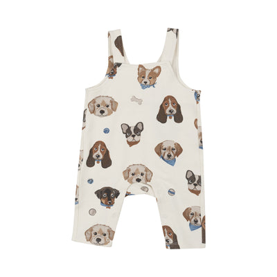 ivory overalls with puppy faces all over it. 