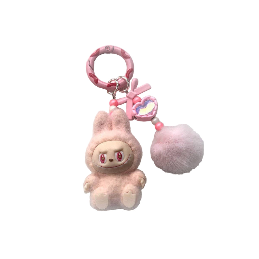 Pink plush keychain with a small character on a white background