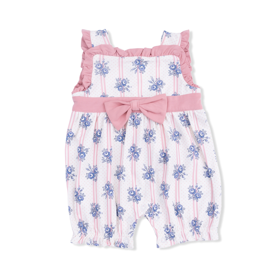 Baby romper with floral pattern and pink bow on a white background