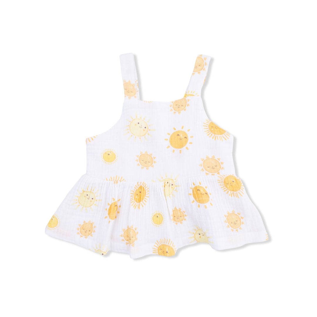 White blouse with yellow sun patterns on a white background