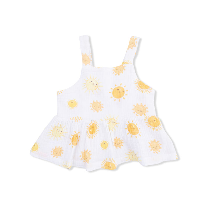 White blouse with yellow sun patterns on a white background