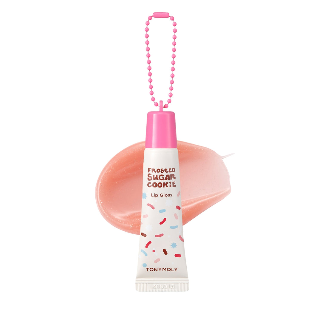 Lip gloss with pink cap and white body featuring colorful sprinkles on a white background