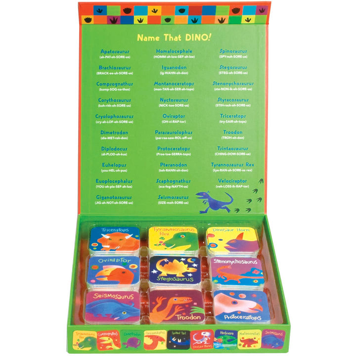 Packaging of 'Name That Dino!' game with colorful dinosaur illustrations on a white background
