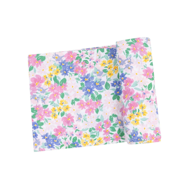 pastel floral swaddle with tiny flowers in shades of pink, blue and yellow. 
