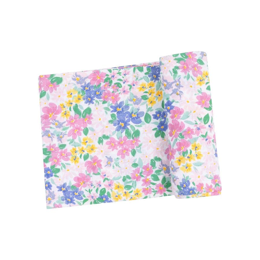 pastel floral swaddle with tiny flowers in shades of pink, blue and yellow. 