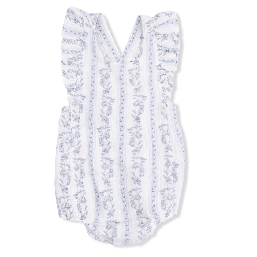 White baby romper with blue floral pattern on a white background