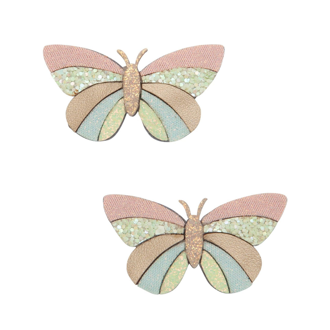 pastel butterflies with gold glitter accents attached to two clips for you hair. 