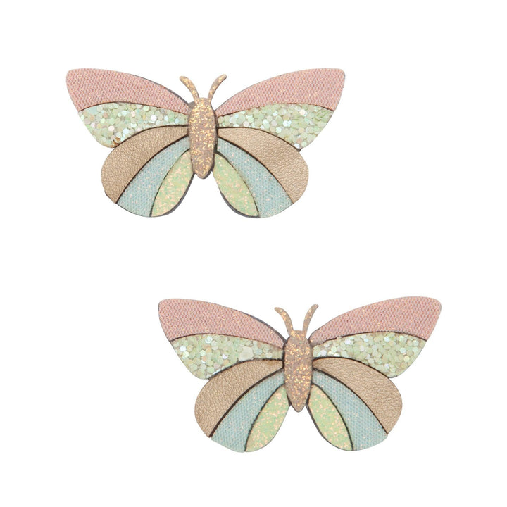 pastel butterflies with gold glitter accents attached to two clips for you hair. 
