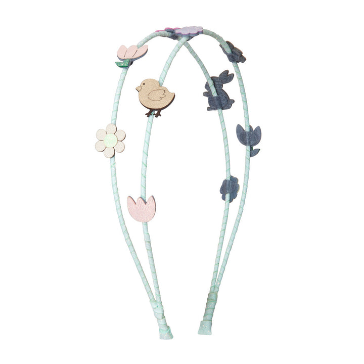 Headband with animal and flower charms on a white background