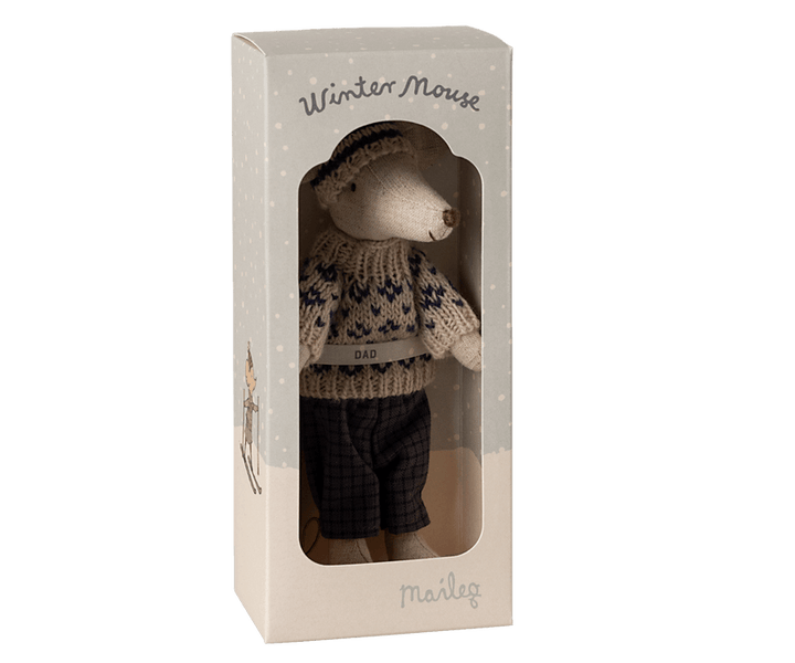 dad mouse dressed in winter attire in the packaging the mouse comes in. 