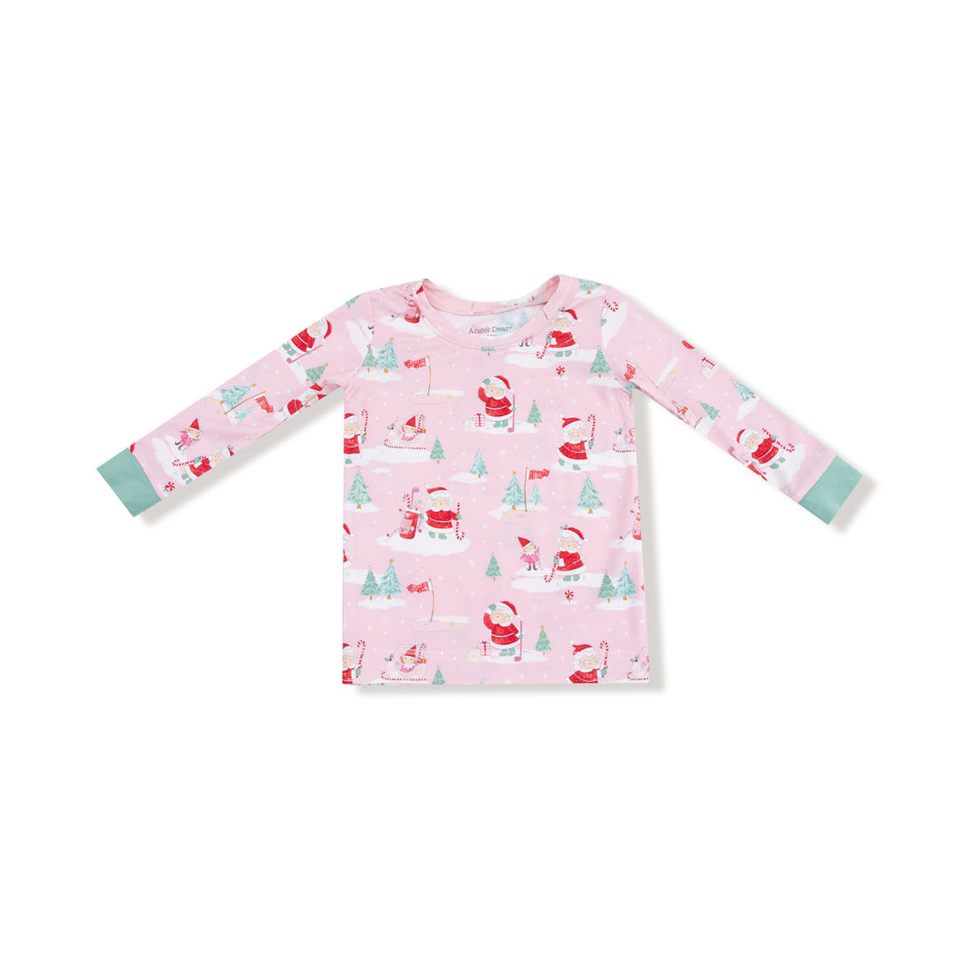 Pink long-sleeve shirt with Christmas-themed pattern on a white background