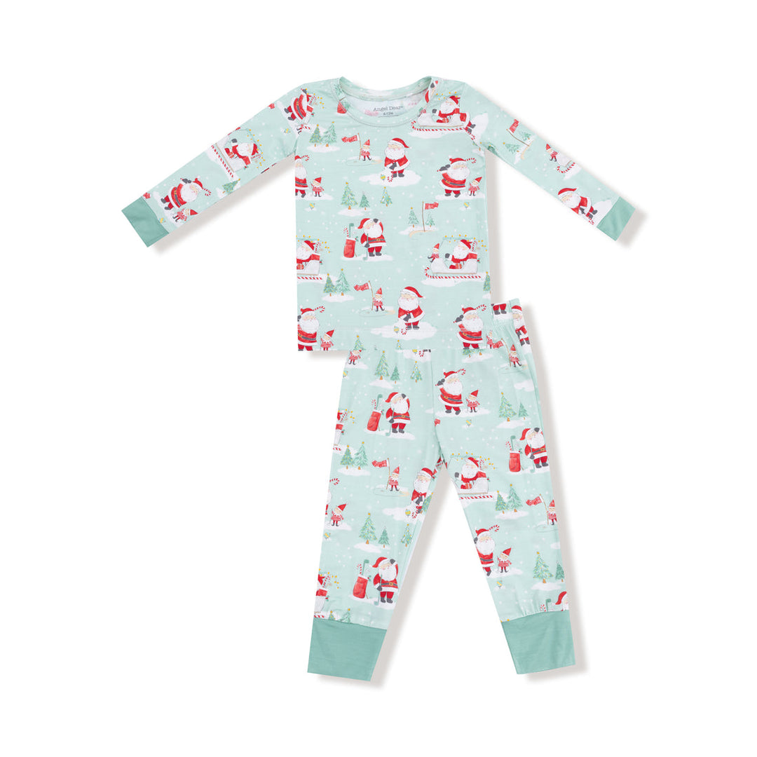 Children's pajama set with Santa Claus and Christmas tree pattern on a light blue background