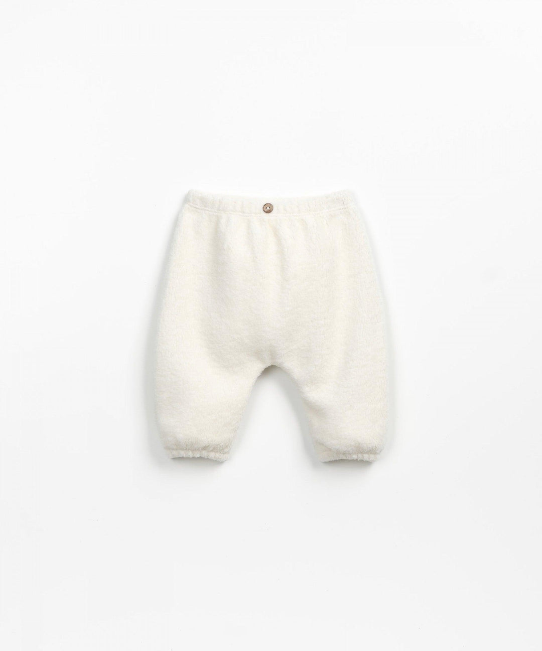 shot of baby pants on their own. beige fuzzy material with single wooden button at the top the of the waist