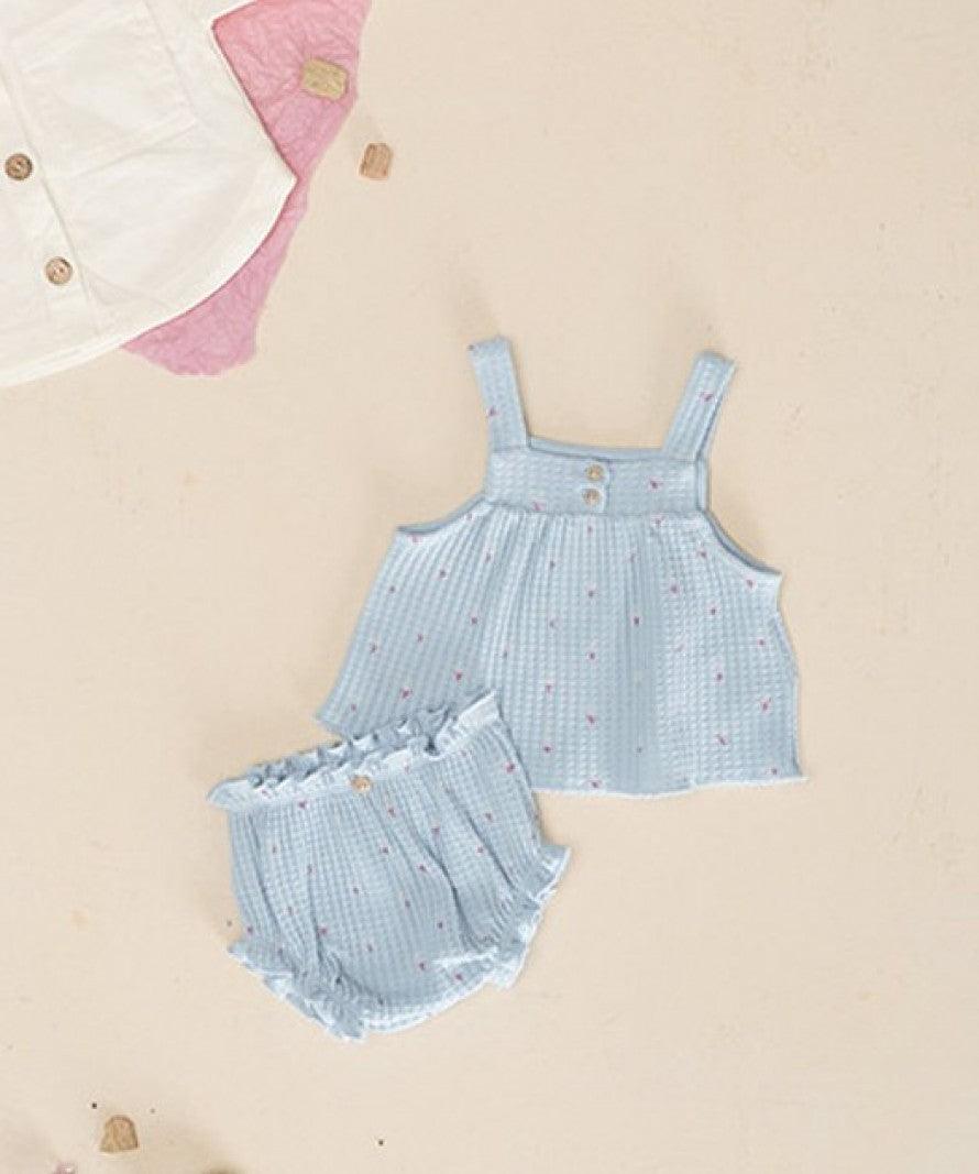 2 piece knit set in powder blue with tiny pink flowers on the top and matching bloomers. 
