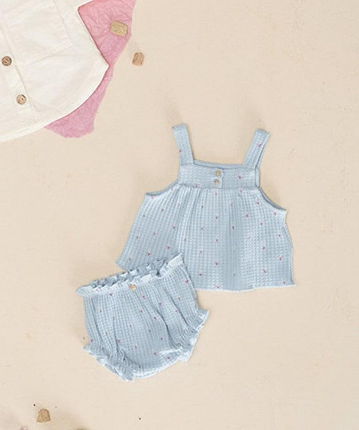 2 piece knit set in powder blue with tiny pink flowers on the top and matching bloomers. 