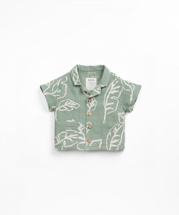 button down sage green baby boy top with notch in the collar. ivory leaf print. 