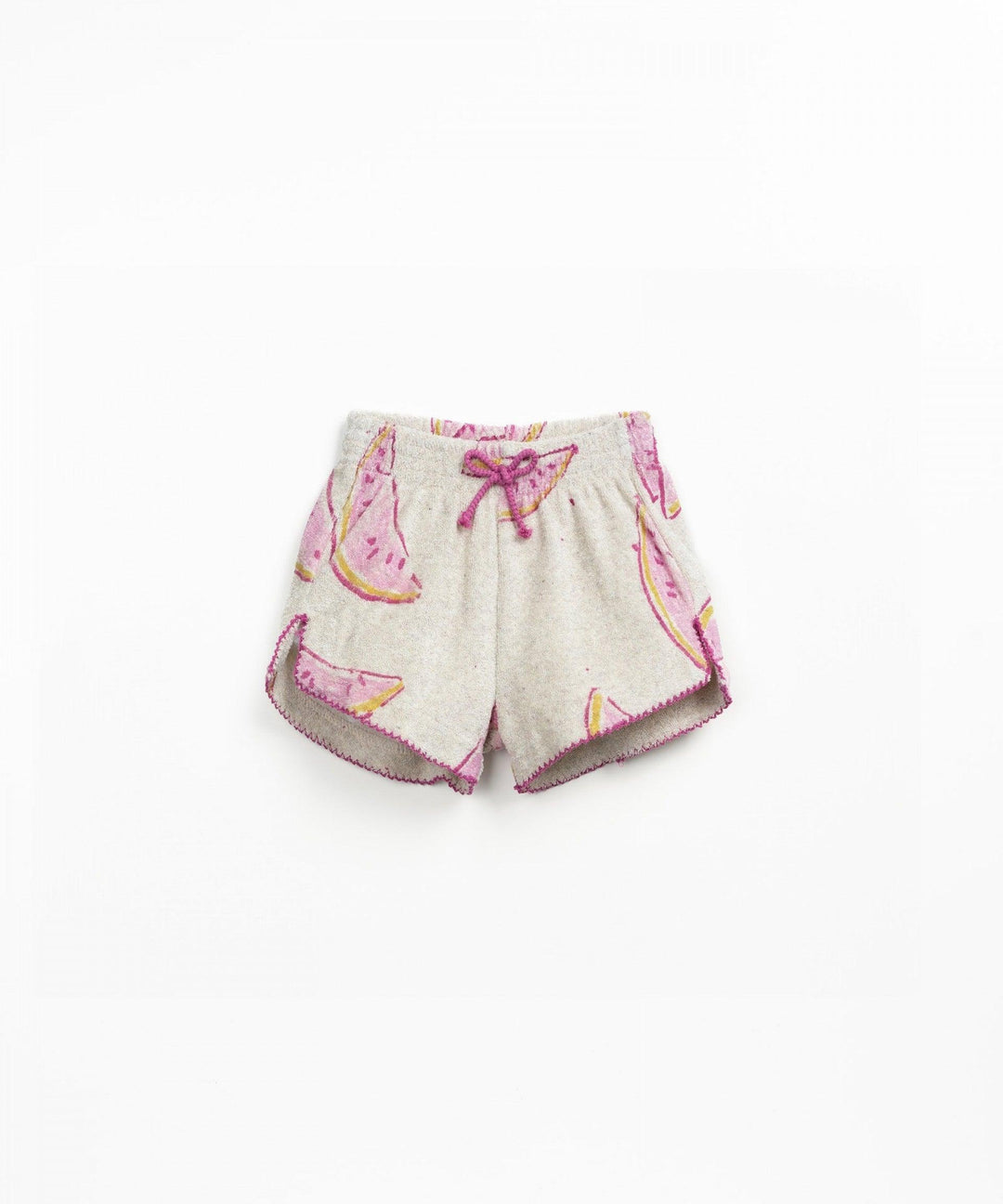 pair of plush shorts, beige color with pink watermelons all over it. edges of shorts finished in fuschia threads. 