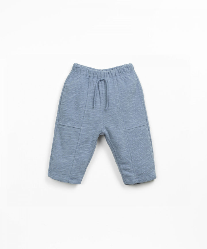 Blue baby pants on a white background