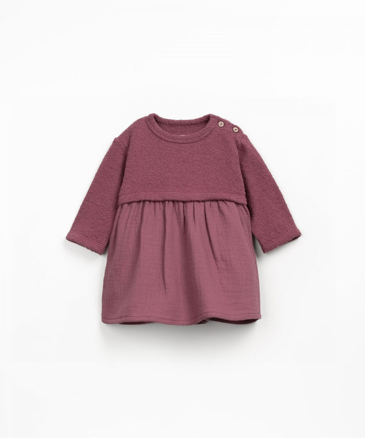 Burgundy dress with long sleeves on a white background