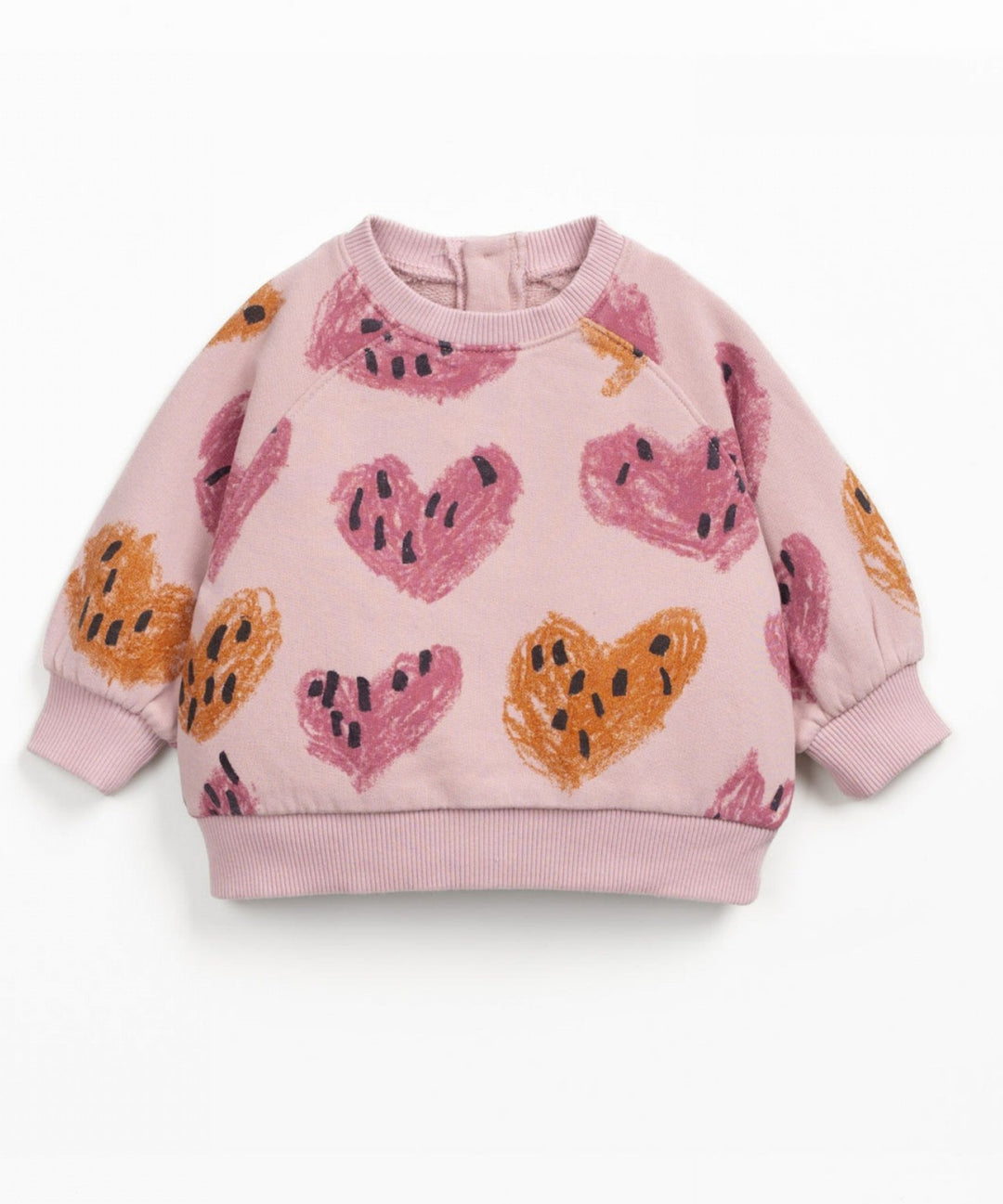 Pink children's sweatshirt with heart patterns on a white background