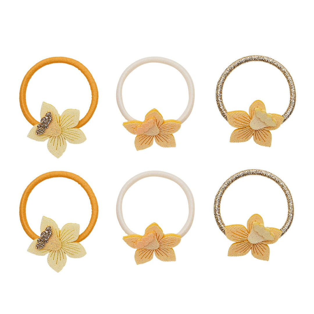 Set of six floral hair ties on a white background